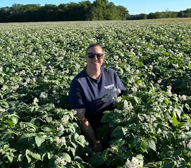 Neumiller Farm employee standing in field